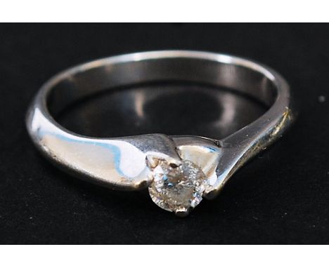A 9k white gold, 25 carat single stone diamond ring.  Size M, weight 3.5 grams