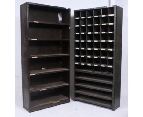 2   original mid 20th century Industrial large enamel metal sectional cubby cabinets. The cabinets each having  multiple shel