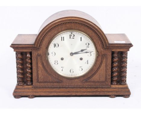 A 1930's Art Deco oak Hamburg & America mantel clock with brass movement, striking on chimes, 8 day movement. H31cm x W44cm x