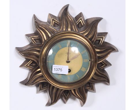 An early 20th century sunburst French gilt metal wall clock by Silvoz of Paris.  Blue chapter ring with roman numerals behind