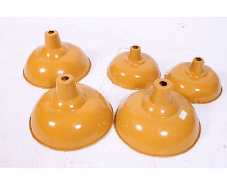 A set of 3 vintage Industrial yellow painted metal pendant shades, 2 x large and 1 x small
