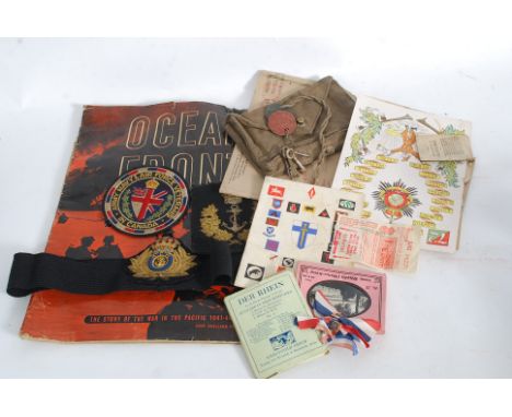 A box of assorted military ephemera and other associated items to include WWI dog tags, uniform pouch, RFA cap patch, menus, 