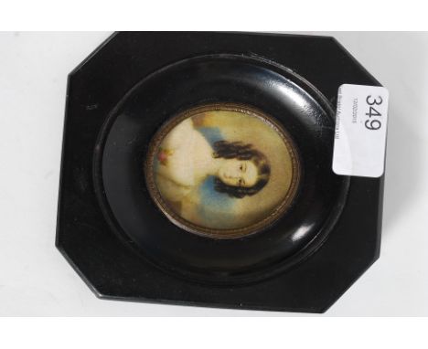 A 19th century miniature painting 3/4 portrait oleograph of a young gilt set in an oval mount. Ebonised frame with paper labe