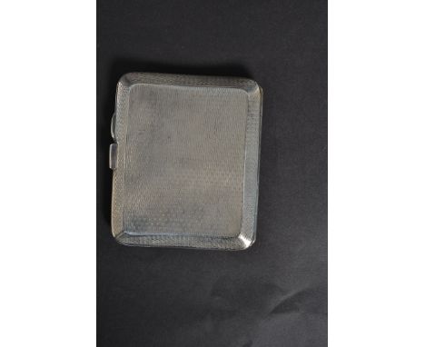 A hallmarked silver cigarette case with unengraved panel to front