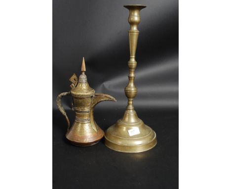 A large 19th century Turkish brass candlestick together with a silver, brass and copper overlay coffee pot of Islamic / Turki