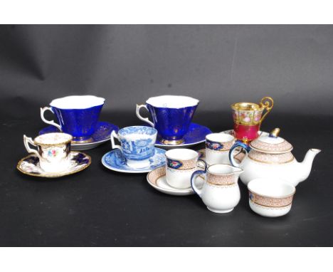 An early 20th century Corona ware miniature tea for 2 tea set / service comprising teapot, cups, saucers, sugar bowl and crea