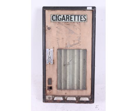 A vintage early 20th century metal enamel painted Cigarette wall hanging vending machine /; advertising machine being wall mo