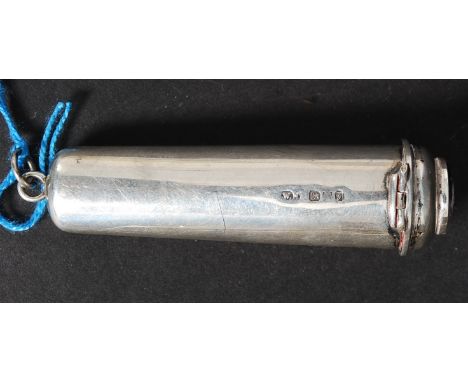A white metal silver cigarette holder case with enamel mount to the end.