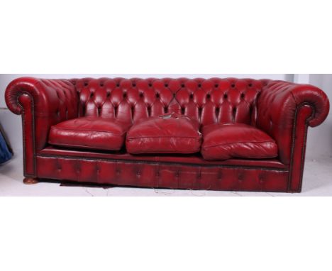 A good quality red leather antique style Chesterfield sofa settee having button backed leather with 3 cushions to centre. ( a