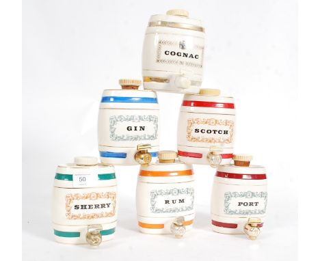 WADE: A collection of 4x Wade Whiskey bottles - one boxed (with contents), along with Wade Barrels.

NOTE: from a large and p