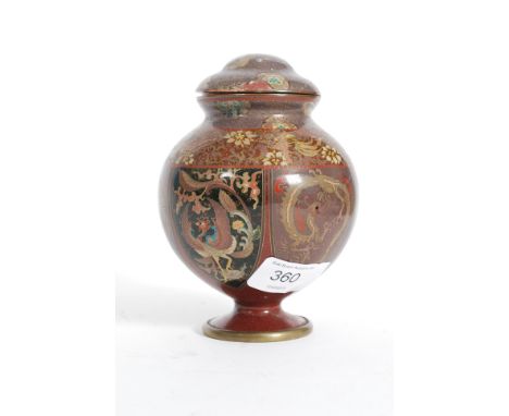 A 19th century Japanese / Chinese cloisonne and enamel worked brass vase / urn. Stylised heavily with scrollwork having centr