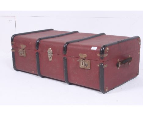 A vintage 20th century retro canvas and wooden strap steamer trunk.  32 x 92 x 52