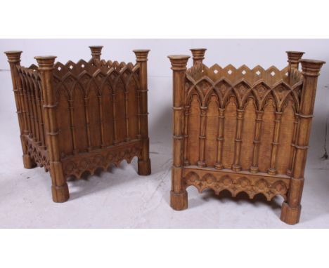 A good pair of 20th century oak style  eclesiastical / Arts & Crafts planters. Raised on octagonal feet having gothic window 