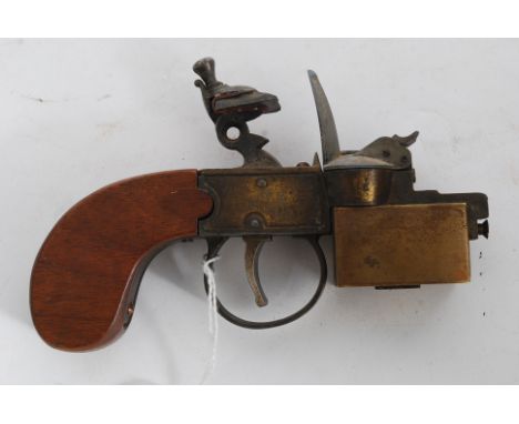 A Dunhill tinder pistol table lighter in the form of a flintlock pistol, inscribed Dunhill Tinder Pistol, made in England, Pa