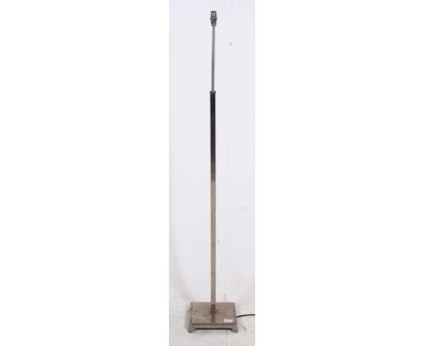 A 1930's Art Deco teak and chrome standard lamp. Square terraced base with chrome and teak upright.  H137cm x W22cm