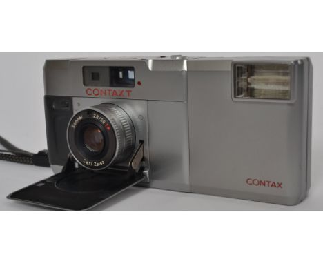 An original Contax T camera, complete with rare flash unit, in original slip case.