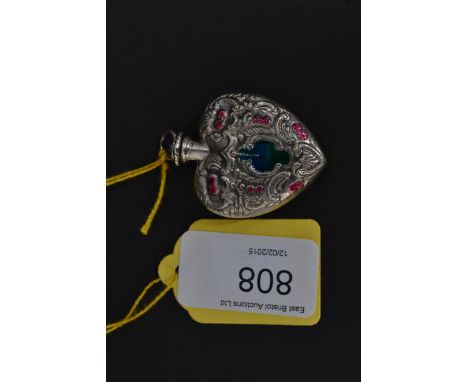 A white metal ( stamped sterling silver ) heart shaped enamel set perfume bottle.