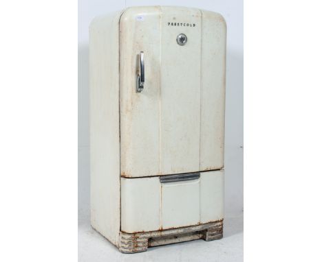 A vintage 1950's Prestcold fridge having the original enamel painted finish with chrome handle and badges, lower pull out tra