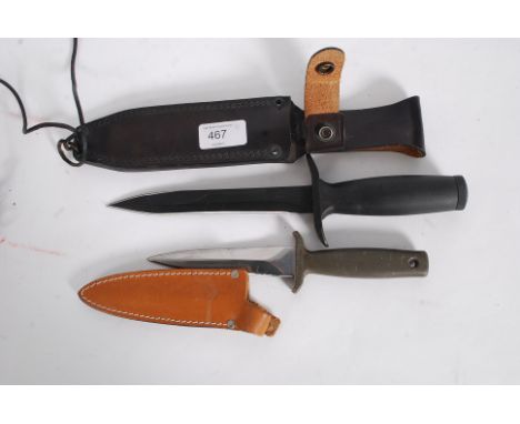 A 20th Rostfrei Solingen West German hunting knife with leather scabbard together with a Carl Schlieper Solingen German Ice T