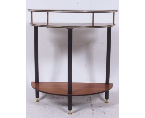 A vintage / retro 3 teak and ebony flashed demi lune console table having ebonised legs and banding with brass detailing else