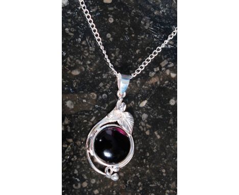 A white metal 925 silver and amethyst pendant necklace in a floral setting on white metal chain.  Weight 6.4 grams