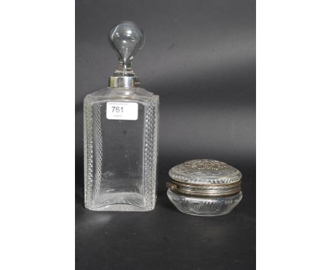 A silver collar cut glass decanter, London hallmarks 1975. Together with a silver hallmarked ashtray, Birmingham marks. Also 