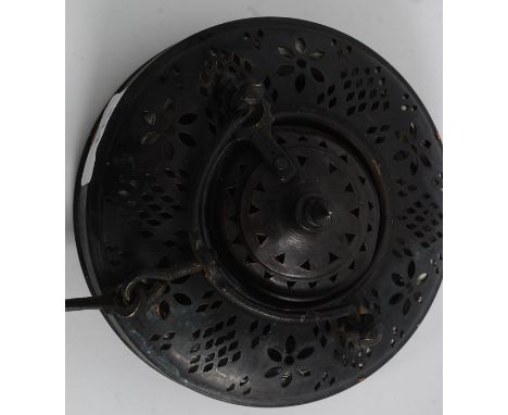 An early 20th century Arabic copper and canvas hanging lantern having pierced top with candle sconce to interior. Measures 40