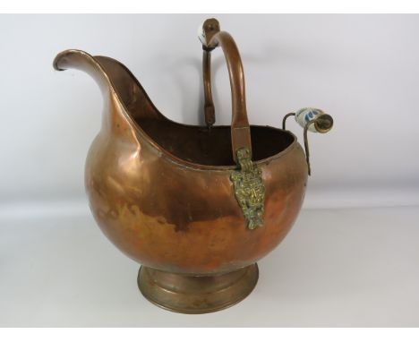 Large vintage copper coal scuttle with ceramic handles and lion head detail, 14.5" tall &amp; 16 1/4" long.
