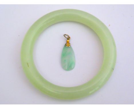 Solid Jade Bangle plus a matching pendant with Yellow Metal Mount. 