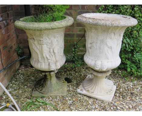 Pair of large Reconstituted Stone Garden Urns which measure approx 36 inches tall by 25 inches wide. Weatherworn condition. T