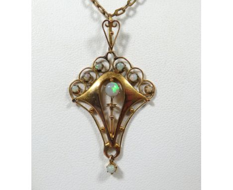 9ct Yellow Gold Art Nouveau style Opal set pendant set on a 15 inch 9ct Yellow gold Neck Chain. Pendant measures approx 35mm 