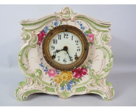 Antique Royal Bonn ceramic Ansonia mantle clock with enamel face, no key and pendulum requires a nut.