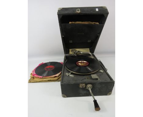 Vintage Deca 10 wind up portable gramophone in working condition, plus a selection of records.
