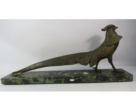 Large bronze effect metal pheasant standing on a marble base. 33" long and 14.5" tall. TOO HEAVY TO BE POSTED COLLECTION OR C