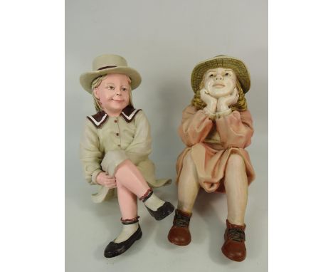 Two large seated shelf figuines of vintage girls, makers marks to the rear, approx 12" tall.
