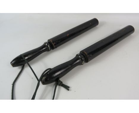 Two vintage wood and metal truncheons, 16" long.