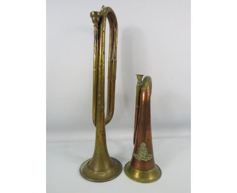 Two vintage trumpets, one Mayers and Harrison arrow marked and dated 1961 and one with the Artillery badge.
