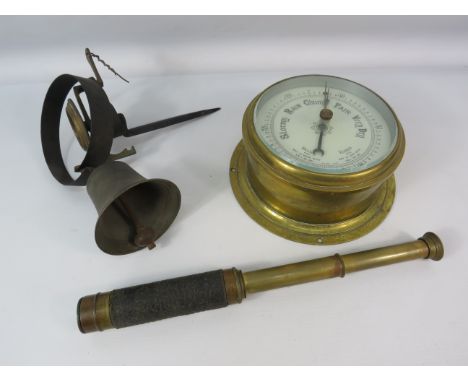 Brass ships barometer, vintage shop bell and a extending telescope.