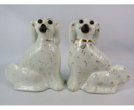 Pair of vintage staffordshire spaniels 11 3/4" tall.