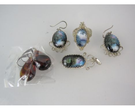 White metal filigree ring, pendant and earrings with handpainted ceramic stones plus a set of faux amber earrings.
