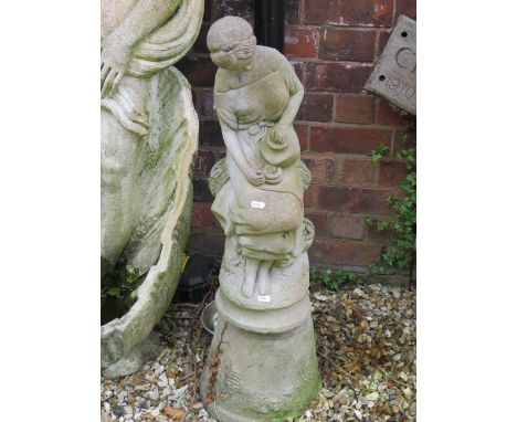 Small Stone Statue standing on a stone pot. 35 inches tall. THIS ITEM IS TOO HEAVY TO POST AND IS FOR COURIER OR COLLECTION