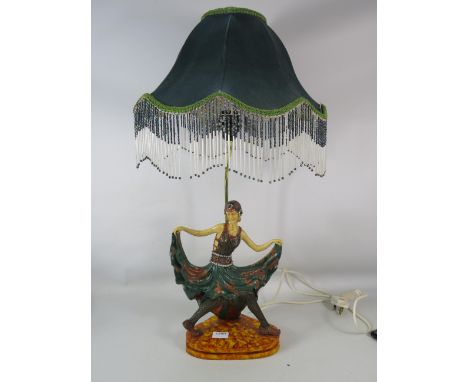Art Nouveau style figural lamp with shade, it stands 22" tall from base to top of light fitting.