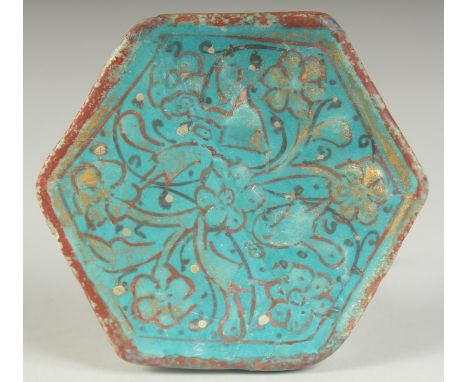 A FINE 13TH CENTURY PERSIAN KASHAN MINAIE GILDED TURQUOISE GLAZED HEXAGON TILE, 10cm at widest point.