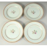 FOUR 18TH CENTURY CHINESE PORCELAIN PLATES, the centre of each with finely painted floral spray,