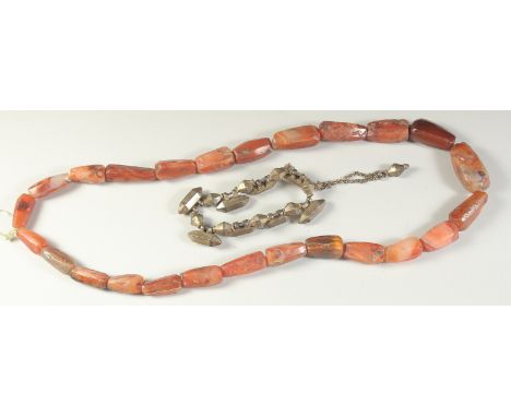 A POSSIBLY ANCIENT AGATE BEADED NECKLACE, along with a Mughal Indian gilt metal bracelet, with possibly small amulet cases, (