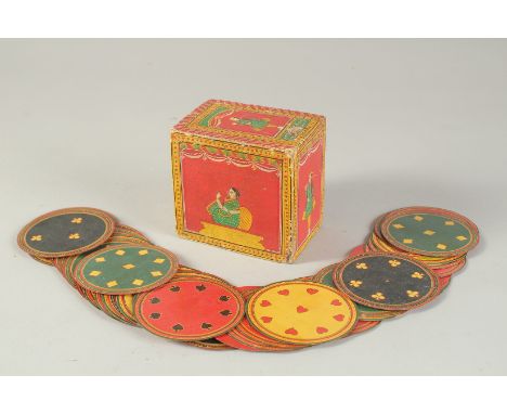 A FINE 19TH-20TH CENTURY INDIAN LACQUERED AND PAINTED BOX OF CIRCUALR PLAYING CARDS, box inscribed, 10cm x 7cm, 10cm high.