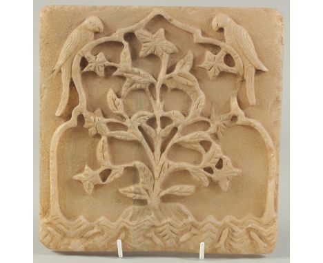 A FINE 18TH CENTURY MUGHAL INDIAN CARVED ALABASTER OR MARBLE TILE, depicting a flowering tree with two parrots, the base with
