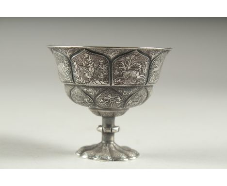 A VERY FINE CHINESE SILVER STEM CUP, embossed and chased with scenes of animals, 6cm high, 7.5cm diameter.