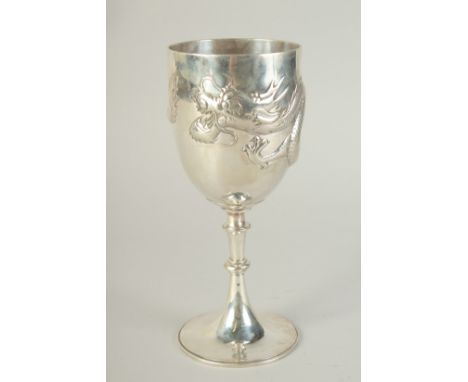 A CHINESE SILVER FOOTED GOBLET CUP WITH EMBOSSED DRAGON, hallmark to base, inscribed to the foot, 23.5cm high.