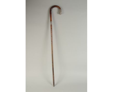 A CHINESE BAMBOO WALKING STICK, with embossed silver mounts, inscribed 'H.E.B', 86cm long.